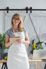 Image showing Photo of young woman florist