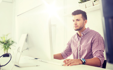 Image showing creative man or student with computer at office