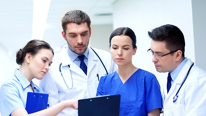 Image showing group of medics at hospital with clipboard