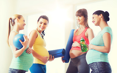 Image showing group of happy pregnant women talking in gym