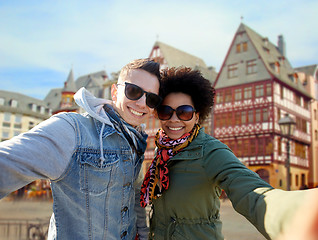 Image showing happy couple taking selfie in frankfurt city