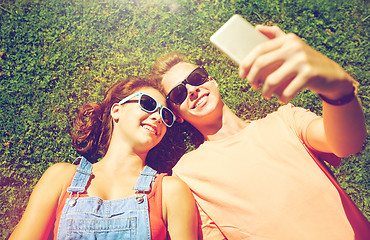 Image showing happy couple taking selfie on smartphone at summer