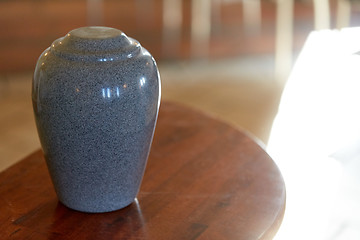 Image showing cremation urn on table in church