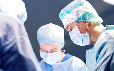 Image showing group of surgeons in operating room at hospital