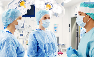 Image showing group of surgeons in operating room at hospital