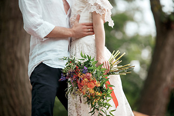 Image showing Wedding decoration in the style of boho, floral arrangement, decorated table in the garden.