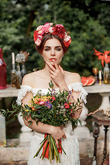 Image showing Wedding decoration in the style of boho, floral arrangement, decorated table in the garden.