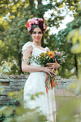 Image showing Wedding decoration in the style of boho, floral arrangement, decorated table in the garden.