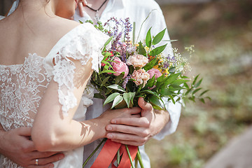 Image showing Wedding decoration in the style of boho, floral arrangement, decorated table in the garden.