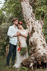 Image showing Wedding decoration in the style of boho, floral arrangement, decorated table in the garden.