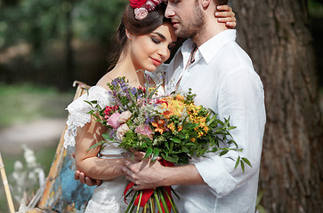 Image showing Wedding decoration in the style of boho, floral arrangement, decorated table in the garden.