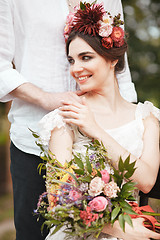 Image showing Wedding decoration in the style of boho, floral arrangement, decorated table in the garden.