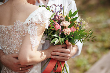 Image showing Wedding decoration in the style of boho, floral arrangement, decorated table in the garden.