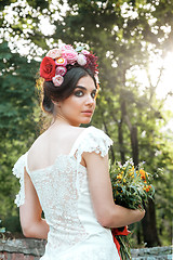 Image showing Wedding decoration in the style of boho, floral arrangement, decorated table in the garden.