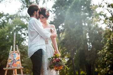 Image showing Wedding decoration in the style of boho, floral arrangement, decorated table in the garden.