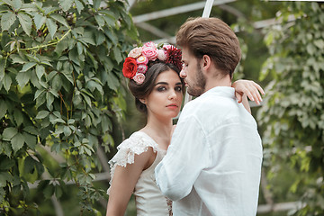 Image showing Wedding decoration in the style of boho, floral arrangement, decorated table in the garden.