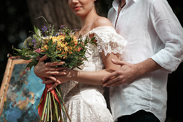 Image showing Wedding decoration in the style of boho, floral arrangement, decorated table in the garden.