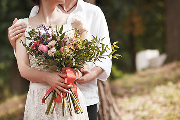 Image showing Wedding decoration in the style of boho, floral arrangement, decorated table in the garden.