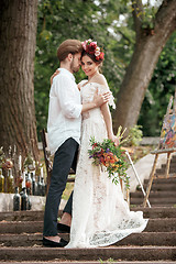 Image showing Wedding decoration in the style of boho, floral arrangement, decorated table in the garden.