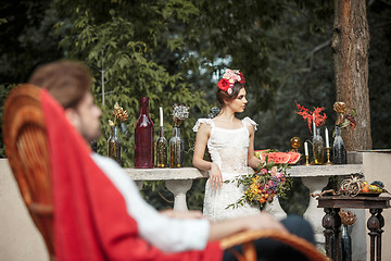 Image showing Wedding decoration in the style of boho, floral arrangement, decorated table in the garden.
