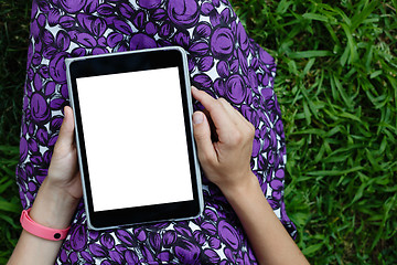 Image showing Woman on grass with tablet