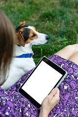 Image showing Woman on grass with tablet