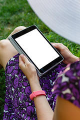 Image showing Woman on grass with tablet