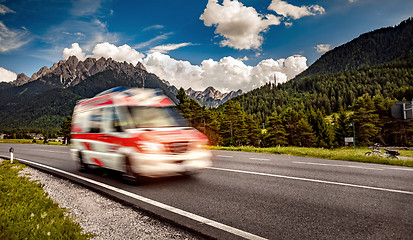 Image showing Ambulance van rushes down the highway