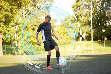 Image showing soccer player playing with ball on field