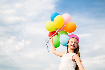 Image showing happy girl in sunglasses with air balloons