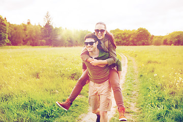 Image showing happy couple with backpacks having fun outdoors