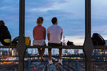 Image showing Young couple on romantic date on urban railway bridge, Munich, Germany.