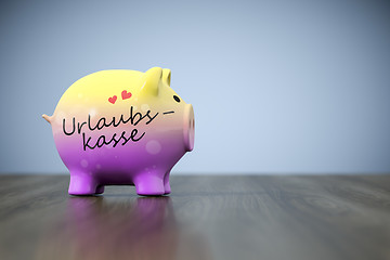 Image showing piggy bank with the word holiday fund in german language