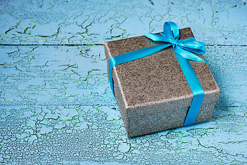 Image showing Gift box with blue ribbon