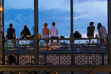 Image showing Young couples on romantic date on urban railway bridge, Munich, Germany.