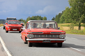 Image showing Red Chevrolet Impala Car Crusing on Highway