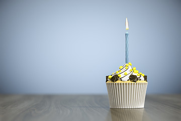 Image showing sweet cupcake with a candle