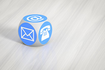 Image showing turquoise cube with signs for email phone and letter