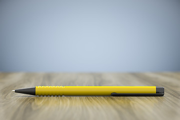 Image showing a yellow pen and lots of space for your content