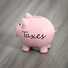 Image showing a pink piggy bank with the word taxes