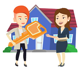 Image showing Real estate agent giving key to new house owner.