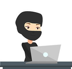 Image showing Hacker using laptop to steal information.