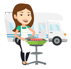 Image showing Woman having barbecue in front of camper van.