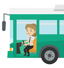 Image showing Caucasian bus driver sitting at steering wheel.