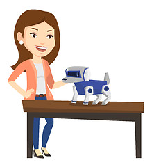 Image showing Happy young woman playing with robotic dog.