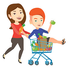 Image showing Couple of friends riding by shopping trolley.