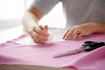 Image showing woman with pattern and chalk drawing on fabric