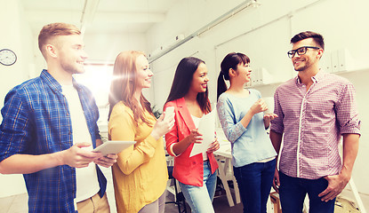 Image showing creative team on coffee break talking at office