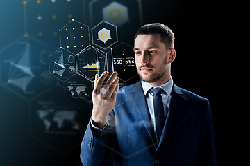 Image showing businessman with smartphone and virtual holograms