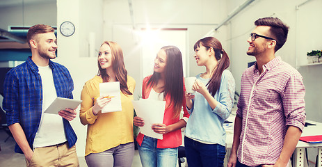 Image showing creative team on coffee break talking at office